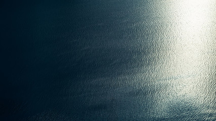 sunlight and ripple on the water.