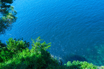 Seascape beautiful coastline. Aerial view of small beach in the rocks with a clear transparent turquoise water.