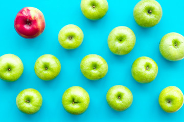 food pattern with green apples on blue background top view