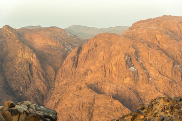 Obraz premium Middle East or Africa, picturesque bare mountain range and a large sandy valley desert landscapes landscape photography