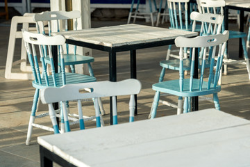 street cafe interior, outdoor wooden tables and chairs