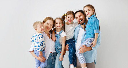 large family mother father and children sons and daughters on white background.