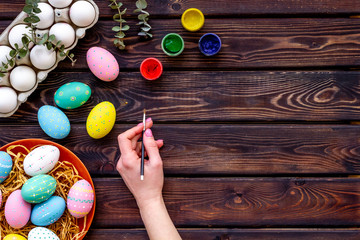 Colorful eggs for easter on wooden background top view mockup