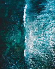 Aerial shot of a wave in the ocean
