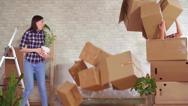 Fale man falls with boxes, problems when moving to a new apartment slow mo
