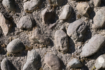 The wall of cemented pebbles