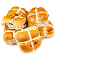 Pile of fresh hot cross buns isolated on white