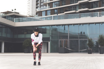 Young sporty woman having knee ache