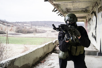 Special forces police soldier training in ruined building airsoft SWAT terrorist