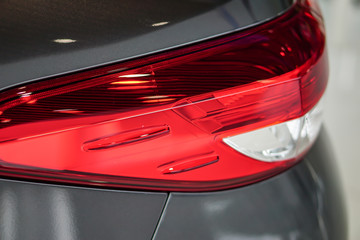Taillight or rear light of new modern technology car in showroom