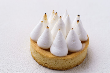 Classical dessert, lemon meringue tart. Tartlet with citrus curd cream filling. traditional recipe, confectionery, restaurant, coffee break, sweet treat