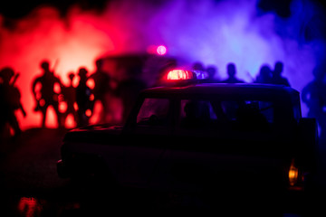 Police cars at night. Police car chasing a car at night with fog background. 911 Emergency response...