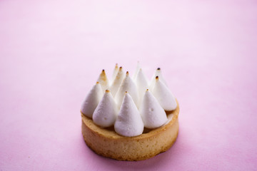 Classical dessert, lemon meringue tart. Tartlet with citrus curd cream filling. traditional recipe, confectionery, restaurant, coffee break, sweet treat