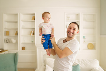 Fototapeta premium father and his son. daddy's little boy. man playing with his adorable baby. father's love, family value, loving relationship