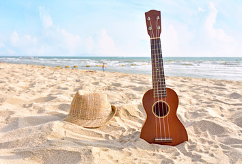Summer Vacation with Guitar ukulele for relax on the beautiful beach