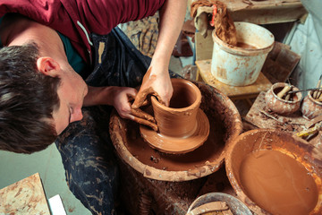 Potter at work. Workshop place.