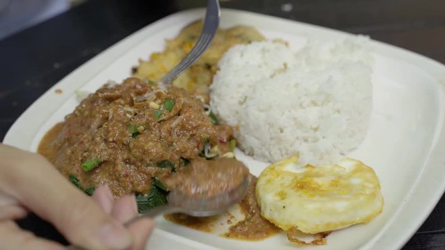 dish of crunchy traditional culinary it is pecel combination of peanuts sauces with white rice