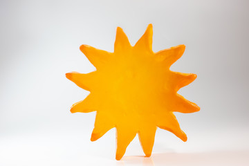 Orange resin star for decoration, image on white background