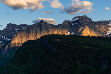 Naklejka premium Evening Light Burns On Mountain Wall