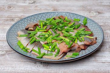 Herring fillet with green onions