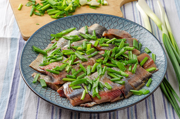 Herring fillet with green onions