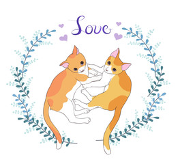 2 cute kittens lying on the ground surrounded by wreaths