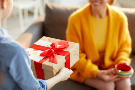 Cropped Shot Of Unrecognizable Child Giving Present To Mom On Birthday Or Mothers Day, Copy Space