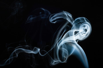 Smoke swirls on black background