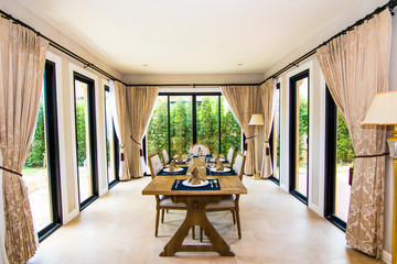 Natural designed dining room with large wooden table