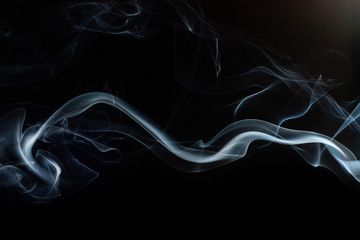 Smoke swirls on black background