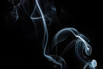 Smoke swirls on black background