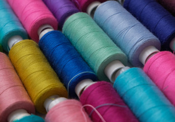 Spools of multicolored sewing threads