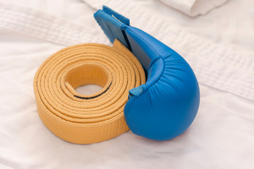 sports equipment for karate - white kimono, lining blue and yellow belt