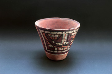 Pre-columbian ceramic called "Huaco" from Nazca, an ancient Peruvian culture. Pre inca handcrafted pottery piece made by this ancient civilization.