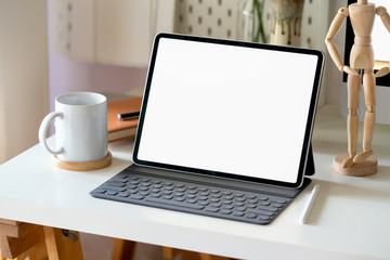 Fototapeta premium Mock up modern digital tablet on workspace