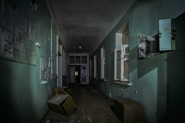 Dark creepy corridor of abandoned building