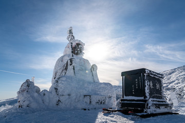 Beautiful silhouette scenic view of Big buddha jizo statue on summit of zao mountain, yamagata, tohoku, japan with snow in winter season. Unseen travel in japan and one of landmark of tohoku.