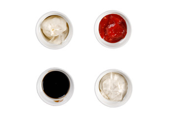 Set of different sauces on white background. Top view.