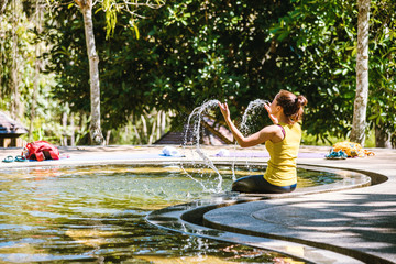 Girl in a pool hot spring in Thailand,Natural Mineral Water,Hot Springs In National Park,Hot Spring nature travel