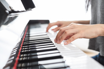 Fototapeta na wymiar Classic piano key with musician hands playing