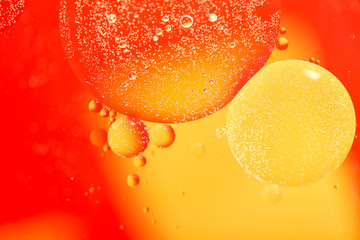 Abstract blurred background. Red and yellow circles and bubbles of different sizes. Cropped shot,...