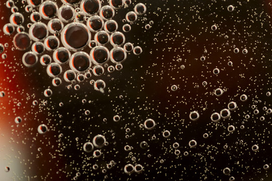 Abstract blurred background. Brown circles and bubbles of different sizes. Cropped shot, macro, horizontal, nobody, gradient, free space for text.