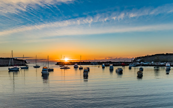 Sunrise and boats in the harbour