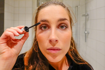 Stockholm, Sweden  A 24 year old woman puts makeup on before going out on a Saturday night.