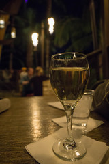 glass of wine on wooden table in restaurant