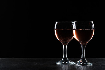Glasses of wine in darkness