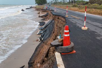 Waves of sea erode the road.