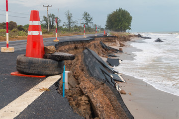 Waves of sea erode the road.
