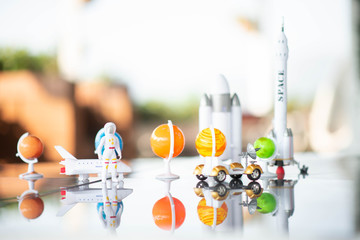Little boy playing space ship and planet galaxy toy