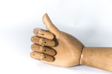 Wooden hand on a white background. With copyspace.